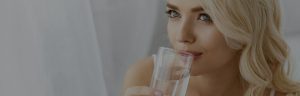 lady drinking a glass of water